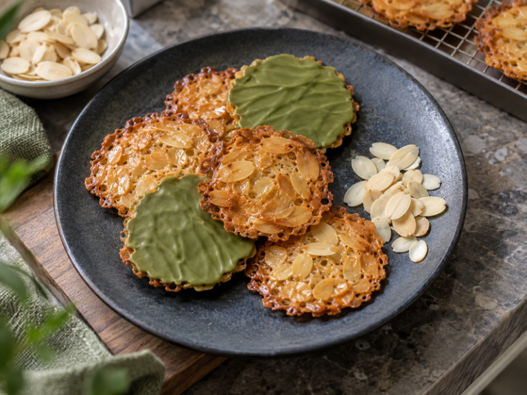 Thin matcha florentines with almond lace and green chocolate coating