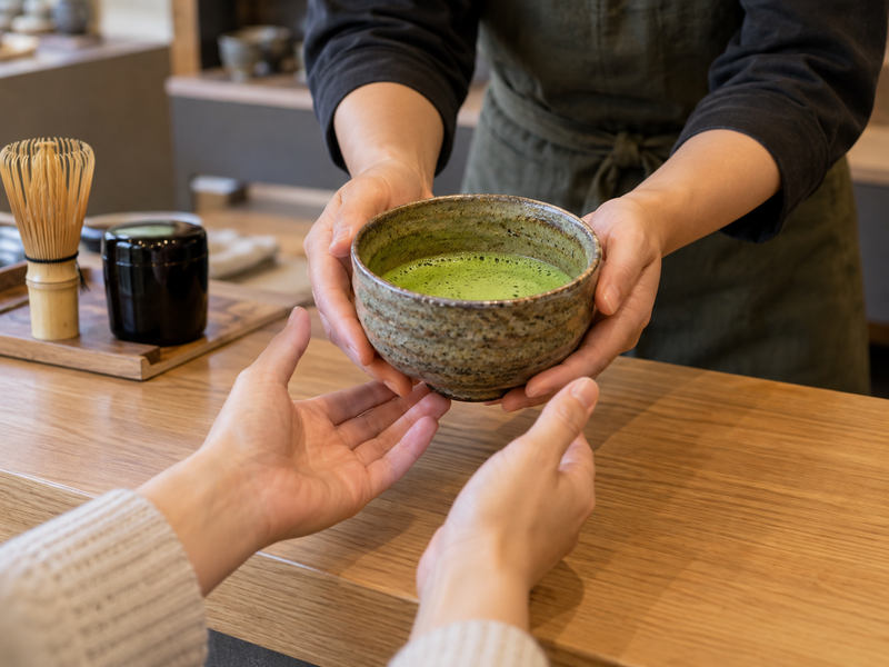 Handmade Matcha Bowl: Prepared matcha bowl handed to a customer