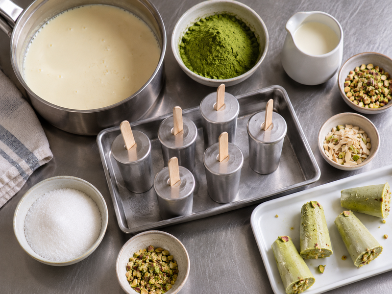 Molded matcha kulfi portions with clean edges and a cut face for sensory review