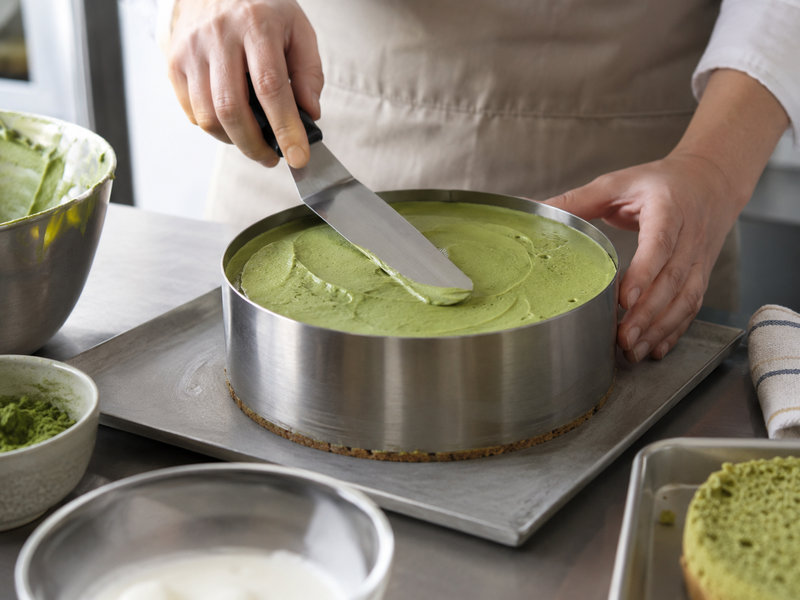 Matcha mousse cake assembled inside a pastry ring