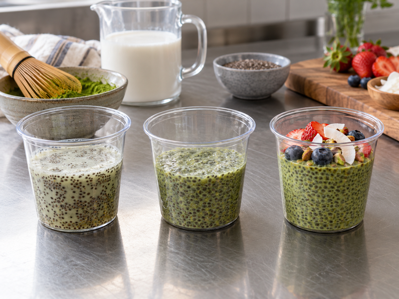 Clear portion cups showing several matcha chia pudding textures and colors