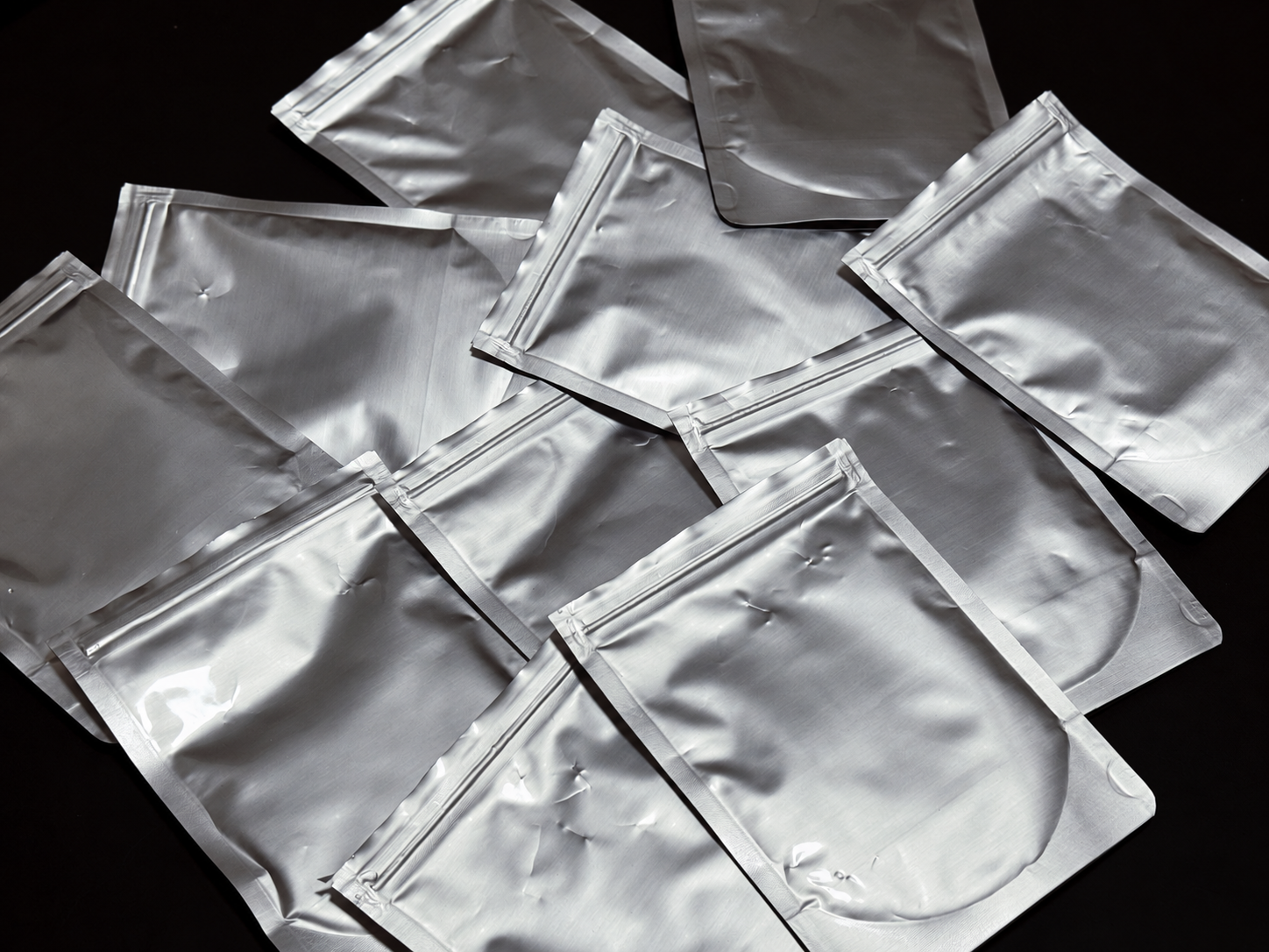 Silver foil pouches arranged for matcha sample evaluation