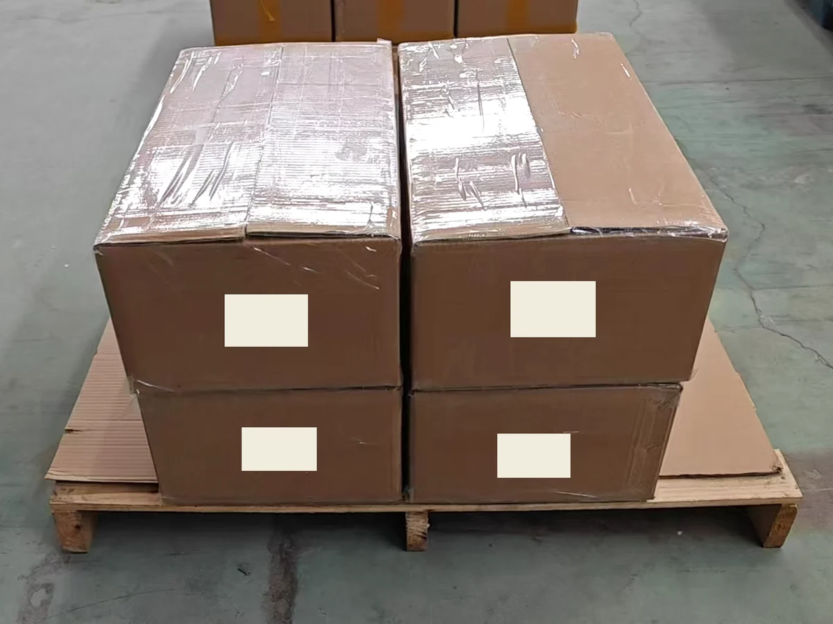Four sealed matcha cartons prepared for dispatch, with labels redacted