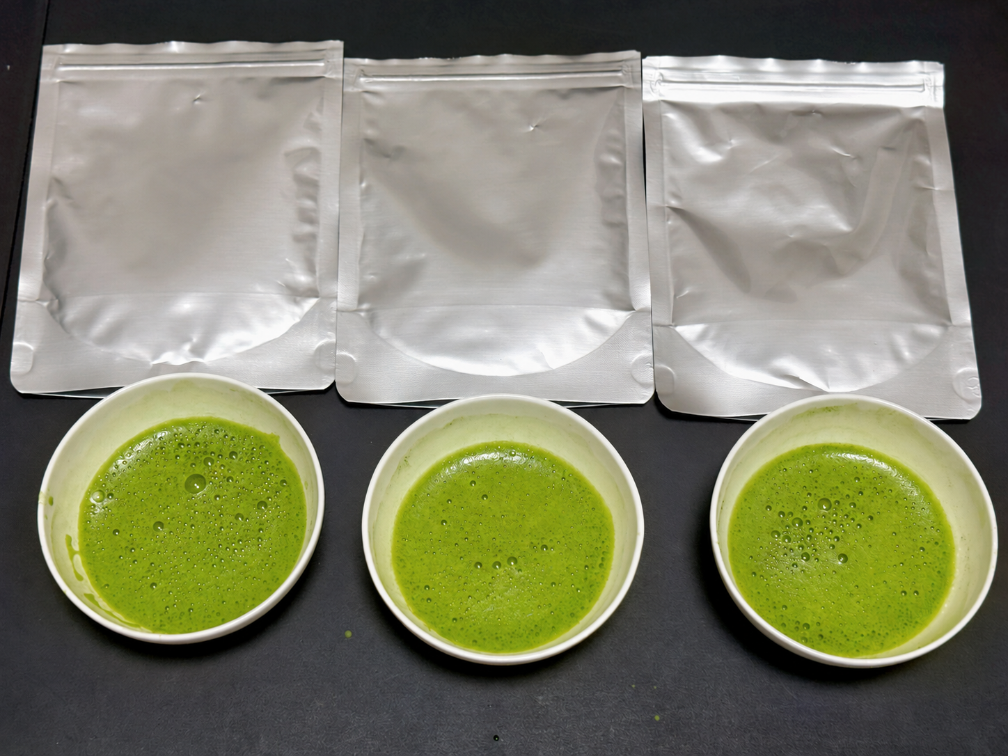 Three matcha samples prepared for visual color comparison