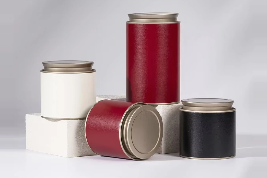 Red, white and black textured tea tins with matching lids