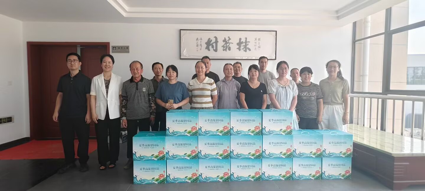 Matcha Village team members standing together with packaged tea products